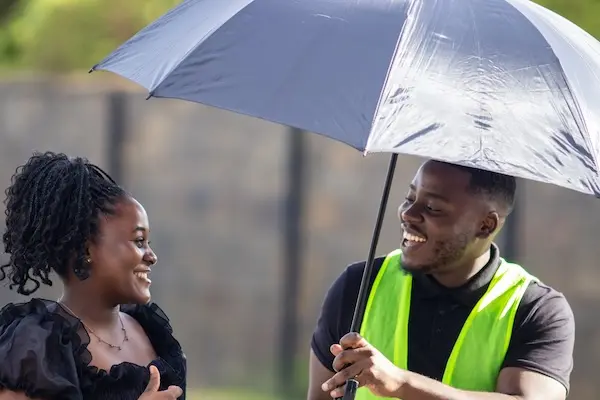 Smiling person being welcomed