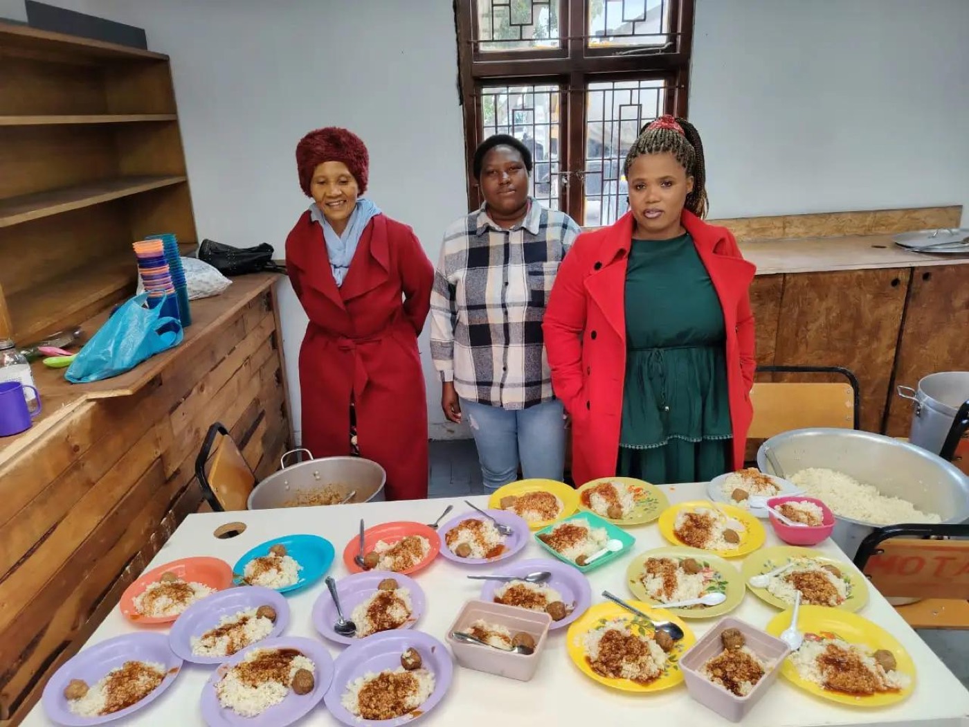 InnerCity Mission volunteers with plated meals ready to serve
